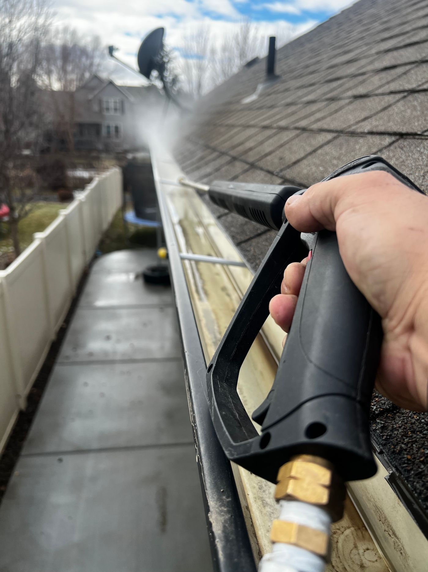 Roofline gutter being jetted clear