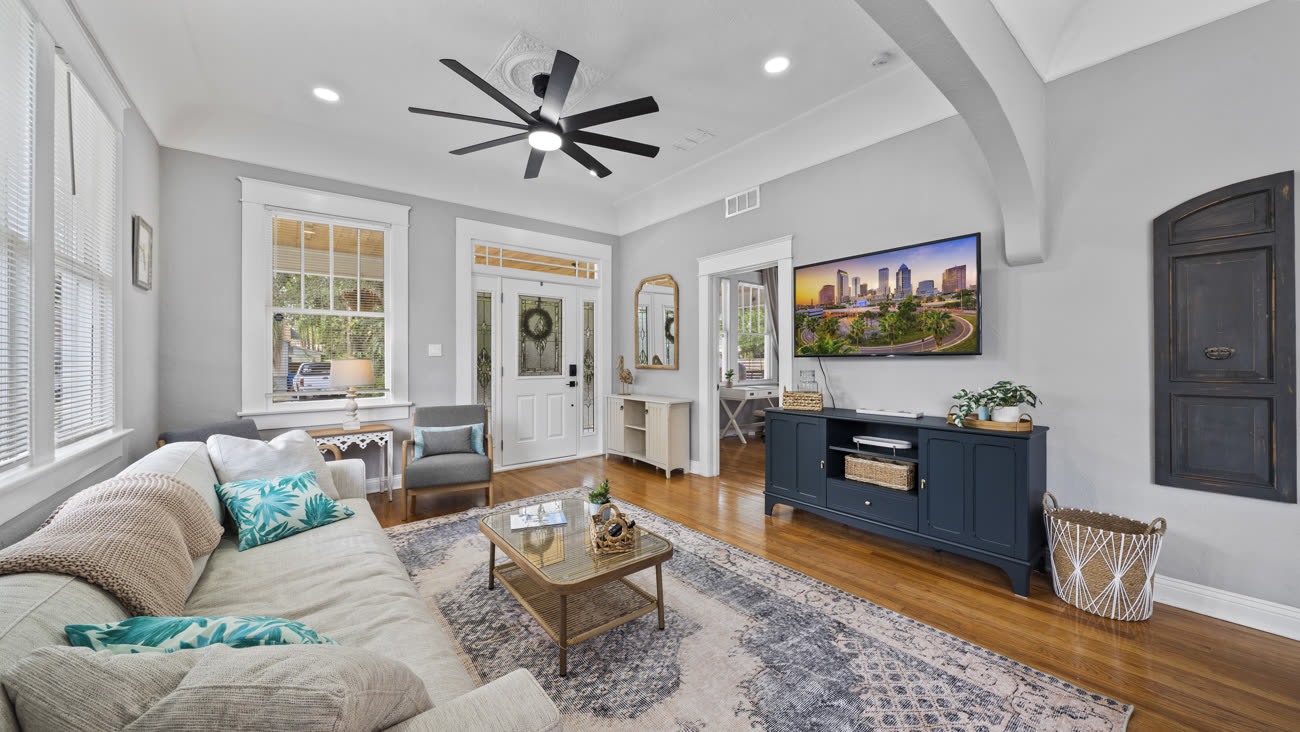 Interior real estate photograph of a living room with hardwood floors in Tampa