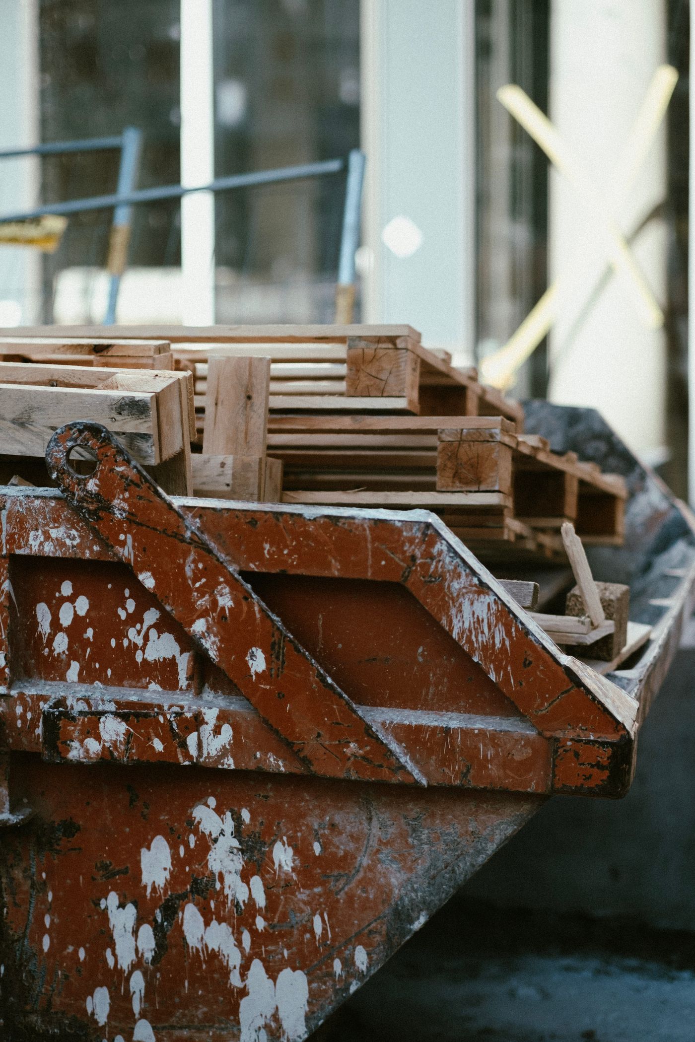 Construction debris and wood pallets staged for haul away